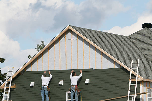 Professional Storm Damage Siding Repair technician working in Du Bois, PA